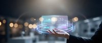 Businessperson holding glowing holographic digital interface with data visualization and network connections in modern office environment for technology solutions.