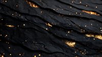 Dark textured surface with golden metallic accents creating luxurious abstract pattern. Dramatic black background with shimmering gold flakes adds elegant design element.