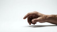 Elderly male hand reaching forward with pointing gesture on clean white background isolated for design and medical concepts.