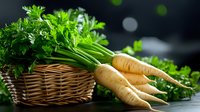 Fresh organic parsnips with green leaves in wicker basket and on dark background. Natural healthy vegetables from garden, raw produce for cooking.