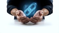 Business professional hands protecting glowing chain link symbol representing connection, partnership, security and digital networking concepts.
