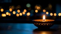 Traditional oil lamp with glowing flame against bokeh lights background creating warm atmospheric lighting for festivals and celebrations.