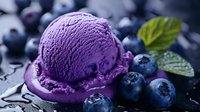 Vibrant purple blueberry ice cream scoop with fresh berries and mint leaves on dark background with water drops, macro food photography for dessert menu.