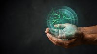Hands holding glowing green digital hologram sphere with network connections on dark background for technology and innovation concepts.