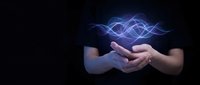 Hands holding glowing blue energy waves on dark background representing digital technology, innovation, and futuristic concepts for business presentations.