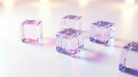 Transparent crystal cubes with purple and pink reflections on glossy surface creating modern minimalist composition for luxury design projects.