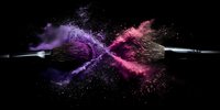 Makeup brushes creating explosive collision of purple and pink powder against black background, capturing dynamic cosmetic art moment.