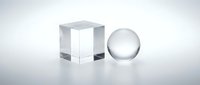 Transparent glass cube and sphere on white surface with soft lighting, suitable for abstract backgrounds and modern design projects.