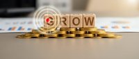 Wooden blocks spelling GROW on golden coins with target symbol representing business growth, investment success and financial development strategy.