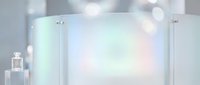 Modern glass panels with soft rainbow holographic reflections and bokeh light effects for contemporary interior design and architectural presentations.