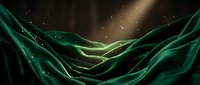 Flowing emerald silk fabric with luminous particles and golden light rays creating an elegant, luxurious abstract background for design projects.