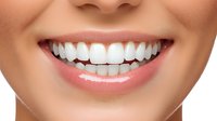 Close-up of woman's radiant smile showing white teeth and healthy pink lips for dental care, oral hygiene and cosmetic dentistry concepts.