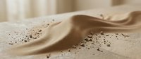 Smooth sand dunes with scattered particles and flowing waves, suitable for backgrounds, nature themes, desert landscapes, and minimalist design projects.