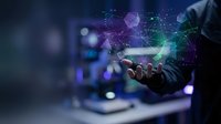 Businessman hand holding holographic digital network connections with glowing data visualization and futuristic technology interface in modern office.