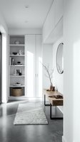 Minimalist entryway with white built-in shelving, wooden console table, round mirror, and neutral decor. Ideal for interior design, home styling, and modern living space inspiration.