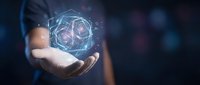 Businessman holding glowing digital sphere with holographic network connections, representing technology innovation, data science, and future business solutions.