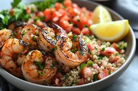 Grilled shrimp skewers served with quinoa tabbouleh salad, fresh tomatoes, herbs and lemon wedges on dark plate, close up view of Mediterranean cuisine.
