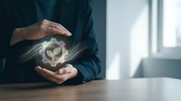 Business professional protecting glowing eco-friendly plant symbol with hands, representing environmental responsibility and sustainable corporate practices.