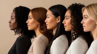 Diverse group of five women in profile showing different ethnicities and hairstyles representing beauty, skincare and multicultural unity concepts.