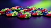 Colorful translucent gel capsules scattered on dark surface with vibrant rainbow lighting effects for pharmaceutical and supplement concepts.