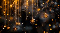Magical golden stars hanging on strings with glowing bokeh lights and sparkles against dark background create festive holiday atmosphere.