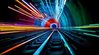 Futuristic railway tunnel with dynamic light trails and motion blur effect creating colorful streaks of neon lights along railroad tracks in perspective view.