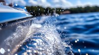 Dynamic water splashing against boat hull creating dramatic spray pattern over blue ocean waves, captured in macro detail with sunlight catching droplets.
