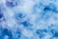 Abstract brushstroke background in shades of blue and white with dynamic texture and ethereal cloudlike patterns creates atmospheric artistic composition.