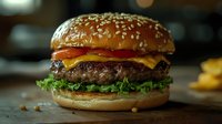 Gourmet burger with sesame seed bun, beef patty, melted cheese, tomato and lettuce on rustic surface. Perfect for food, restaurant and culinary marketing.