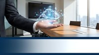 Professional businessman presenting holographic cloud computing technology with digital network icons floating above palm in modern office conference room.