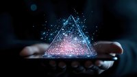 Glowing holographic triangle with blue and pink particles floating above cupped hands against dark background, creating magical futuristic atmosphere.
