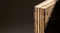 Vintage weathered book with worn leather binding and aged pages on dark background for antique literature and education concepts.