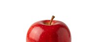 Fresh red apple with glossy skin and brown stem isolated on white background for healthy eating concepts and food design projects.