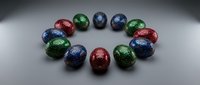 Colorful metallic Easter eggs arranged in circle on gray surface with dramatic lighting for holiday celebration and spring decoration concepts.