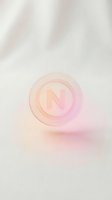 Translucent glass sphere with letter N inside on soft pink gradient background for modern branding and logo design projects.