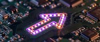 Glowing purple arrow symbol on computer circuit board with electronic components and microchips. Technology concept for digital navigation and data processing.