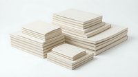 Stacks of blank white paper sheets arranged in neat piles on white background, office supplies for printing, writing and business documentation.