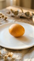Fresh brown chicken egg on white ceramic plate with baking ingredients and rolling pin in rustic kitchen setting for cooking and recipe preparation.