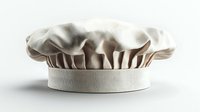White professional chef toque hat with pleated top and textured fabric detail on clean white background, isolated culinary uniform element.
