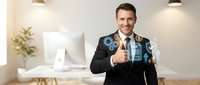 Professional businessman in dark suit giving thumbs up with digital technology icons and data graphics overlay in modern office environment.