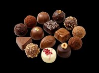 Assorted chocolate truffles and bonbons isolated on transparent background, ready for culinary design, packaging, print-on-demand, and food-related graphics.