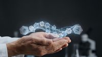 Mature male hand holding glowing digital hexagonal network structure against dark background, representing data connectivity, technology innovation, and business solutions.