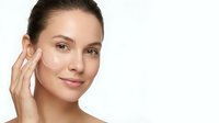 Young woman applying facial cream skincare routine natural makeup clean skin beauty treatment moisturizer anti-aging cosmetics wellness self-care.