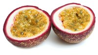Fresh passion fruit halves with golden pulp and black seeds isolated on white background for culinary and tropical food designs.