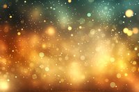 Magical glowing bokeh lights on dark background with golden and turquoise gradient colors create dreamy atmospheric effect for festive designs.