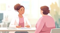 Female healthcare professional in white coat consulting with patient in pink attire at desk in bright medical office setting.