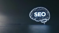 Digital brain hologram with SEO text glowing in neon blue light on dark reflective surface, representing search engine optimization and digital marketing concept.