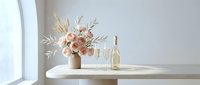 Elegant table setting with blush roses bouquet, champagne bottle and glasses in a bright minimalist interior, perfect for wedding or celebration themes.