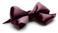 Elegant burgundy satin bow with soft sheen isolated on white background, ready for design projects and gift wrapping applications.