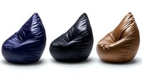 Modern bean bag chairs in navy blue, black and brown leather arranged in row on white background, isolated furniture for interior design and home decor.